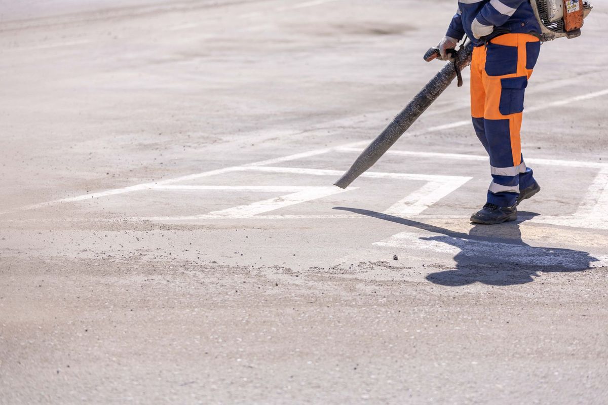 Professional window washer cleaning bright residential windows in Hemet